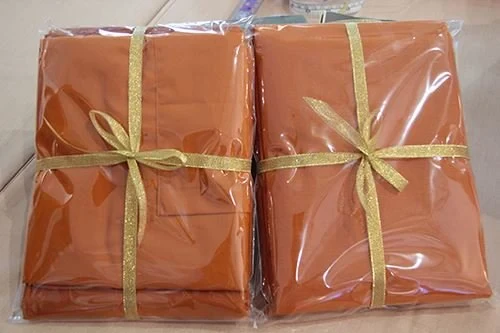 ซิงเกอร์ เชิญชวนตัดเย็บ "ผ้าอาบน้ำฝน และผ้าอังสะ” สำหรับเทศกาลเข้าพรรษา 2557